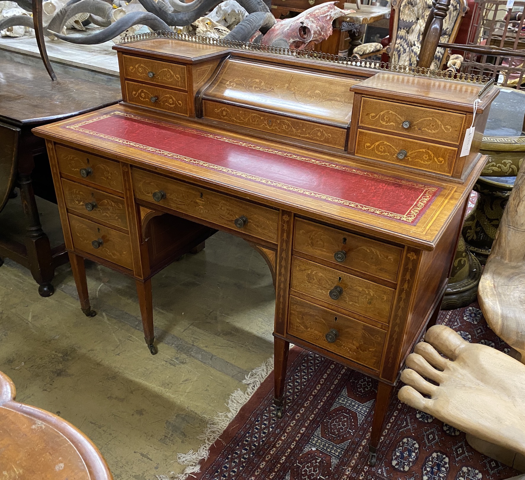 An Edwardian Edwards & Roberts Sheraton Revival satinwood banded marquetry inlaid mahogany kneehole writing desk, width 122cm, depth 60cm, height 95cm